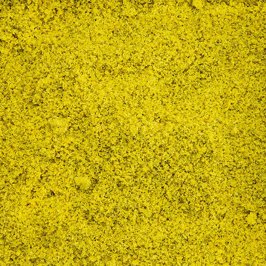 A close-up image of a 1 kg package of green pistachio semolina, also known as Pistachegriesmeel, a versatile and nutritious ingredient for cooking and baking
