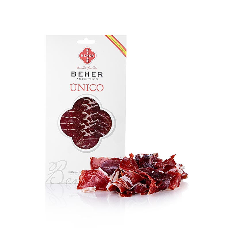 A close-up image of Jamon Iberico Cebo de Campo Unico, gesneden ham, Beher, 100 g showcasing the marbling of the rich, flavorful Spanish ham