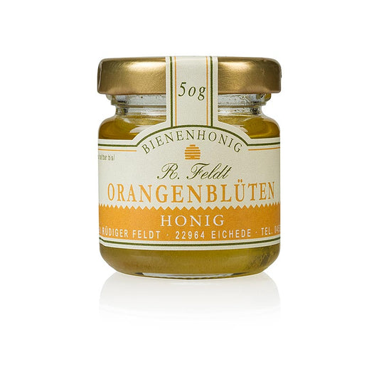 Alt text : Miel doré liquide de fleurs d'oranger d'Espagne dans un pot de 50 g.