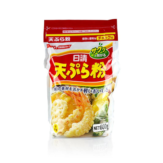 Image en gros plan d'un emballage de 600 g de pâte à frire Tempura, une pâte à frire de style japonais pour la friture, montrant l'étiquette du produit et le design de l'emballage.
