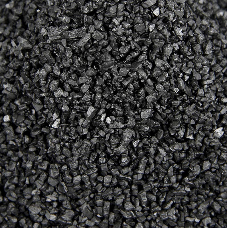 Gros plan sur le sel noir du Pacifique Palm Island avec charbon actif, texture grossière, sac de 1 kg, idéal pour un usage décoratif, emballage d'inspiration hawaïenne 