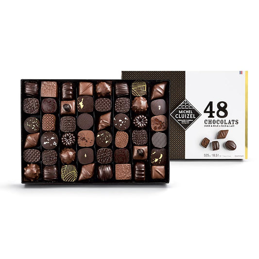 Assortiment de 48 chocolats gourmands dans le Coffret N48 de Michel Cluizel, 525g, 48 pièces, parfait pour se faire plaisir et offrir.