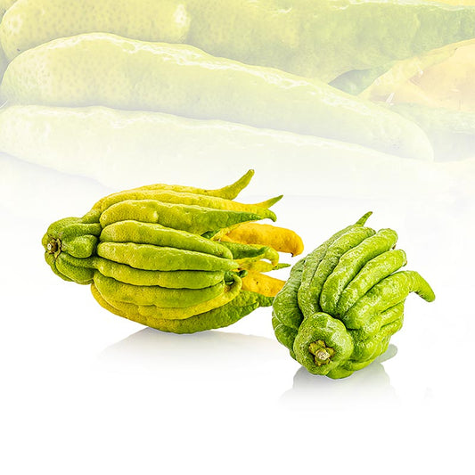 Image en gros plan de la main de Bouddha, produit finger lemon (écorce de citron confite), frais et pesant environ 450 g, avec un morceau présenté.